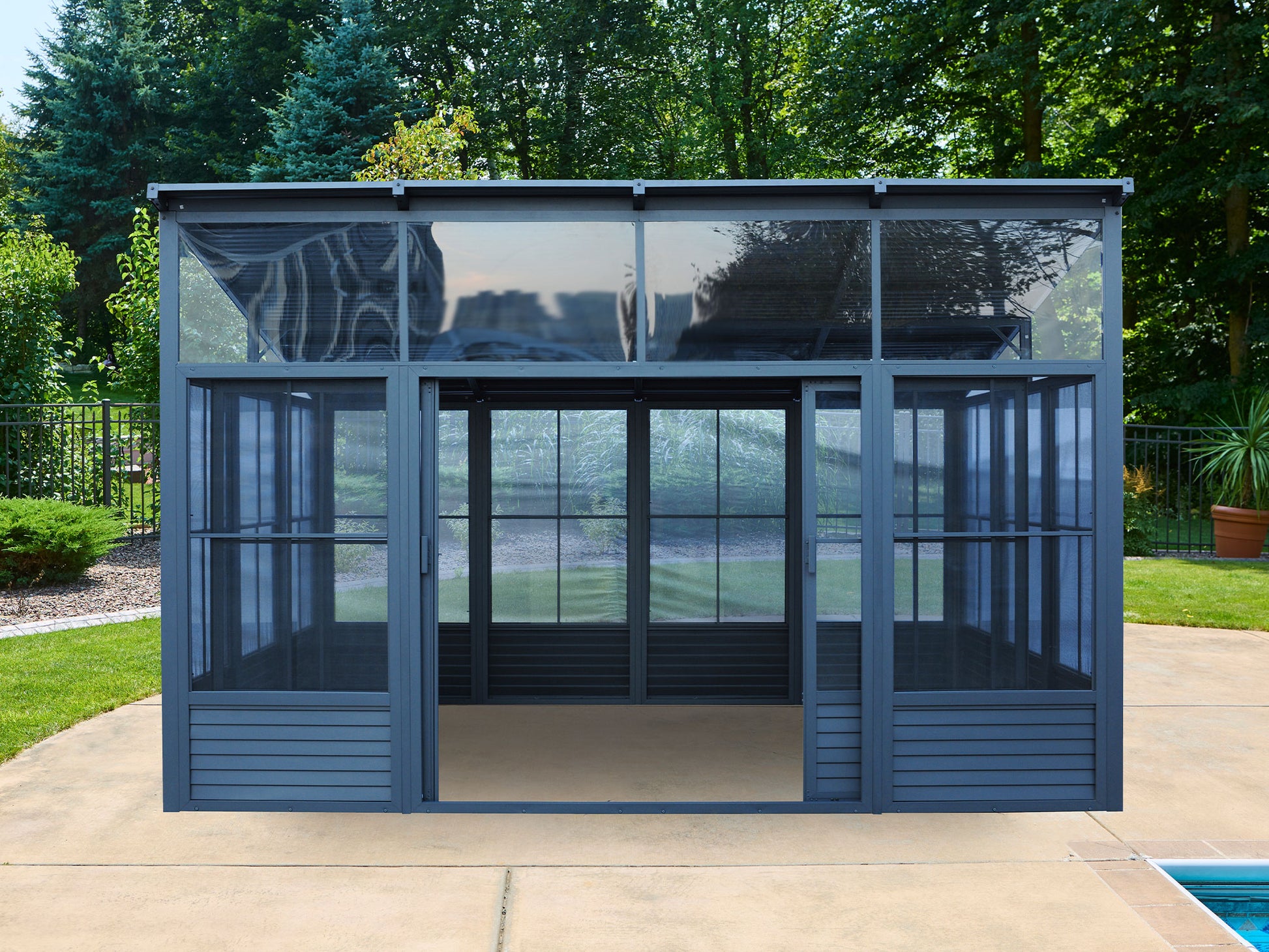 Narvik Solarium 12x15 with Grey Aluminum Frame and Metal Roof in Backyard Setting
