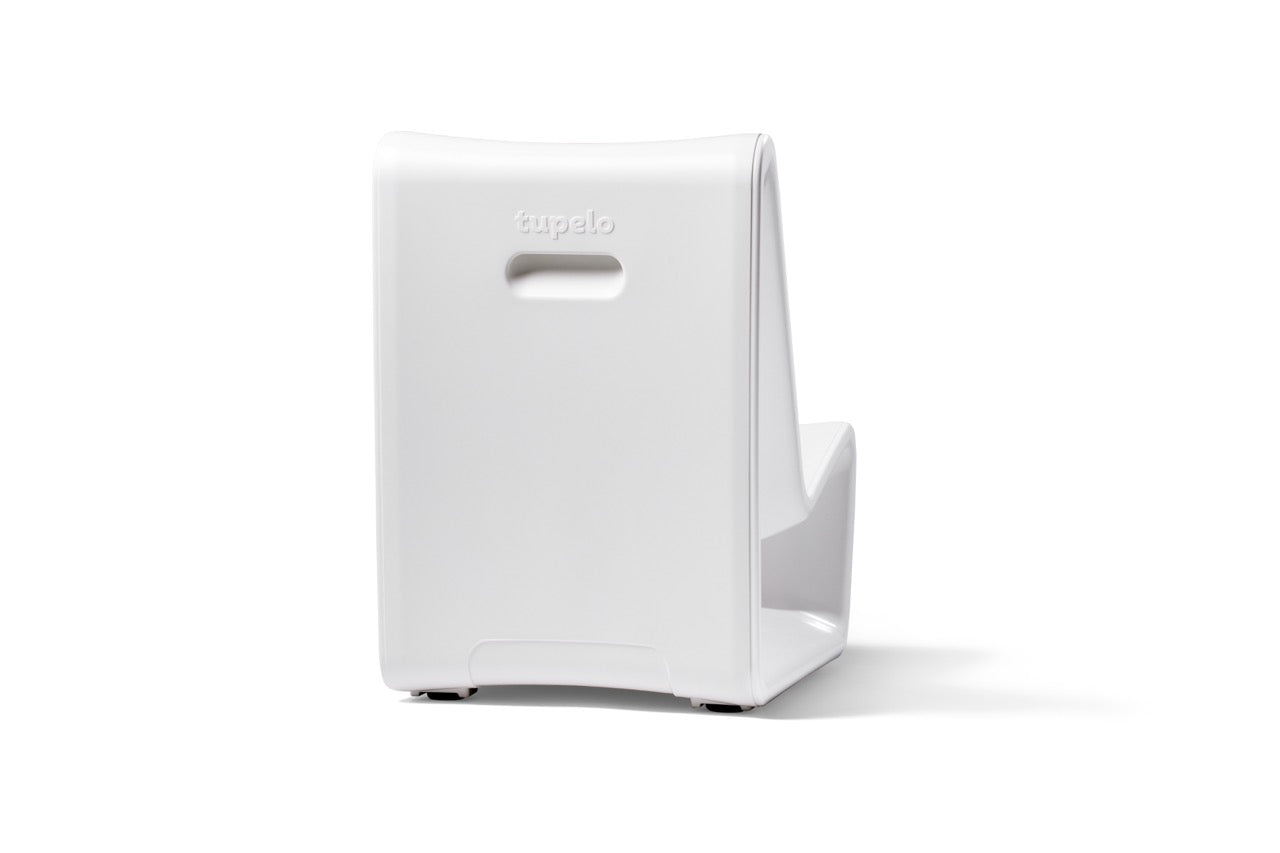 Back view of commercial-grade white concrete lounge chair with integrated handle for repositioning
